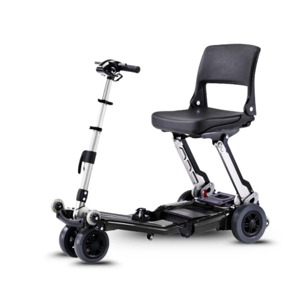 The FreeRider Luggie Standard Travel Scooter is a lightweight, foldable four-wheel mobility scooter with a black seat and handlebars, designed for easy transport and convenient use by those with mobility challenges.